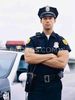 57279095-portrait-of-a-policeman-standing-with-his-arms-photos-com.jpeg